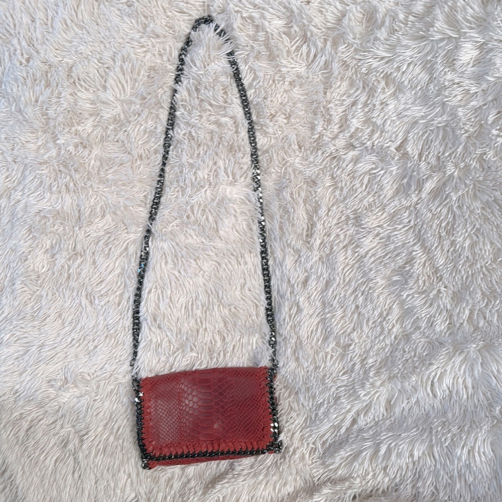 Red Leather crocodile Crossbody Handbag and metallic chain shoulder strap.